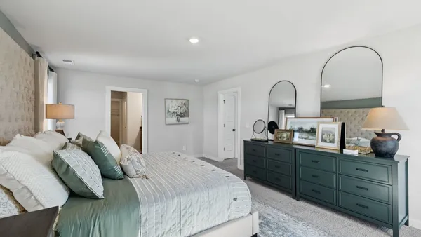 a view of a wooden chairs and table in the yard