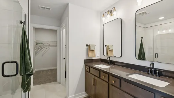 a view of a lake with houses in front of it