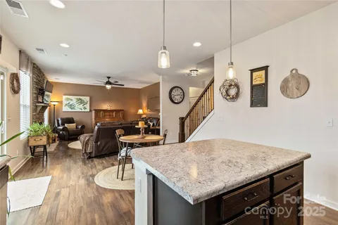 a kitchen with a table and chairs in it