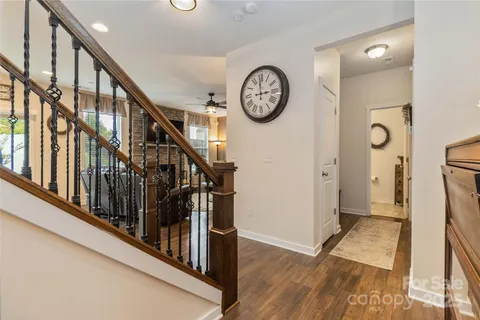 a view of a hallway with wooden floor and a hallway