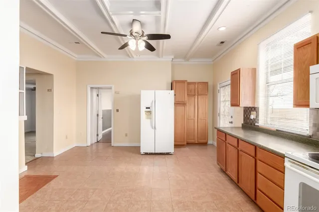 a view of a kitchen with a sink and a window