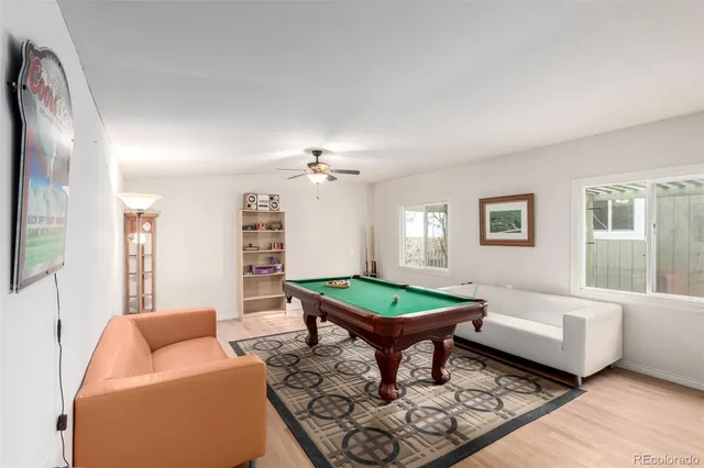 a living room with furniture a table and a window
