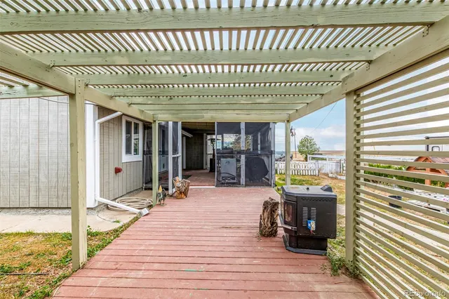 a view of a patio with swimming pool table and chairs
