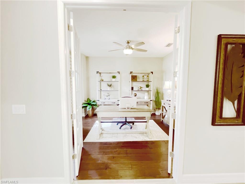 1975 Mustique Street Naples, FL 34120 - Photo 16 of 42 view of living room with furniture and window
