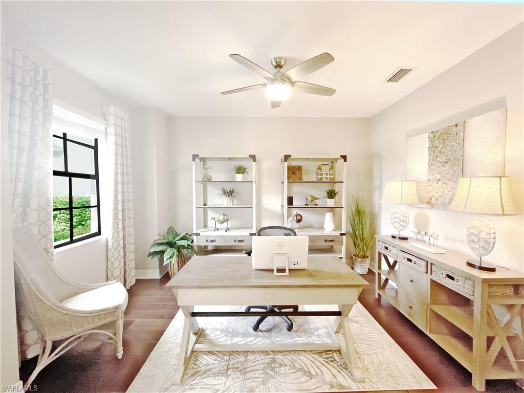 1975 Mustique Street Naples, FL 34120 - Photo 17 of 42 a living room with furniture fireplace and a large window
