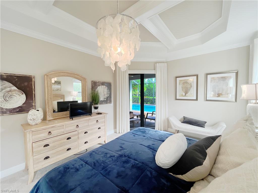 1975 Mustique Street Naples, FL 34120 - Photo 20 of 42 a living room with furniture and a large mirror