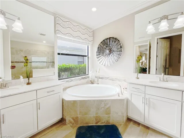 a bathroom with a bathtub and a sink