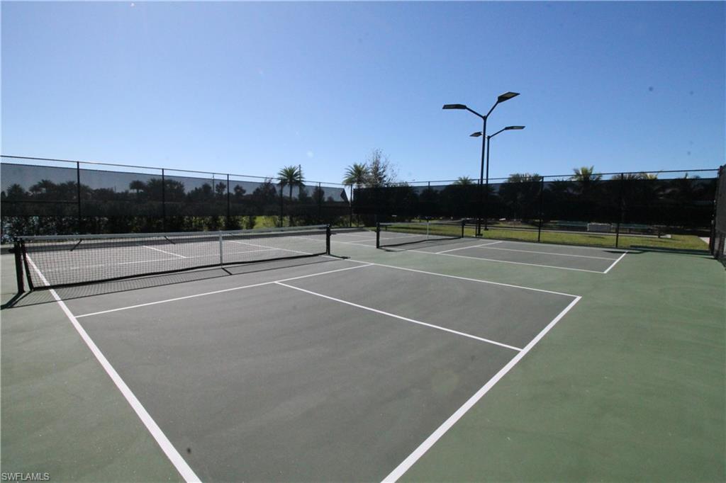 1975 Mustique Street Naples, FL 34120 - Photo 38 of 42 a view of a tennis court