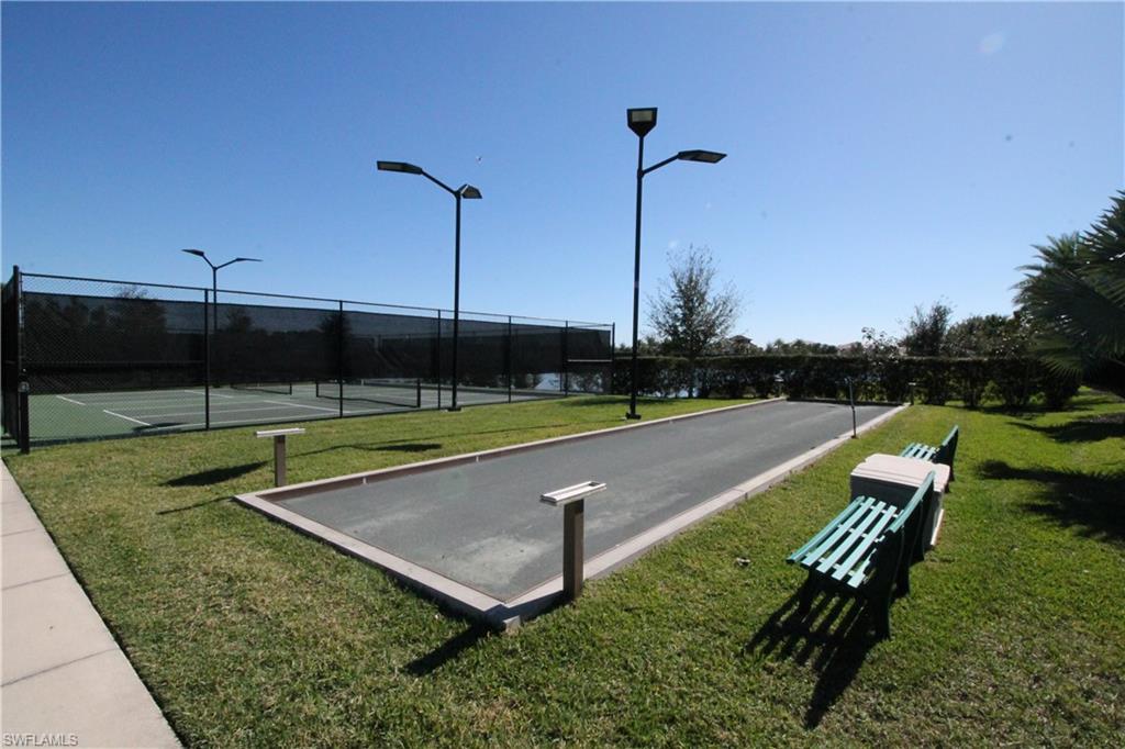 1975 Mustique Street Naples, FL 34120 - Photo 40 of 42 a view of a garden with sitting area