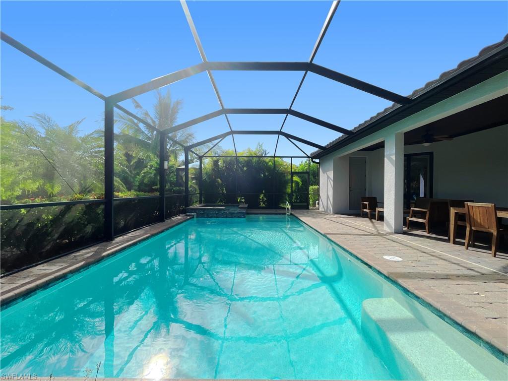 1975 Mustique Street Naples, FL 34120 - Photo 5 of 42 a view of a backyard with patio