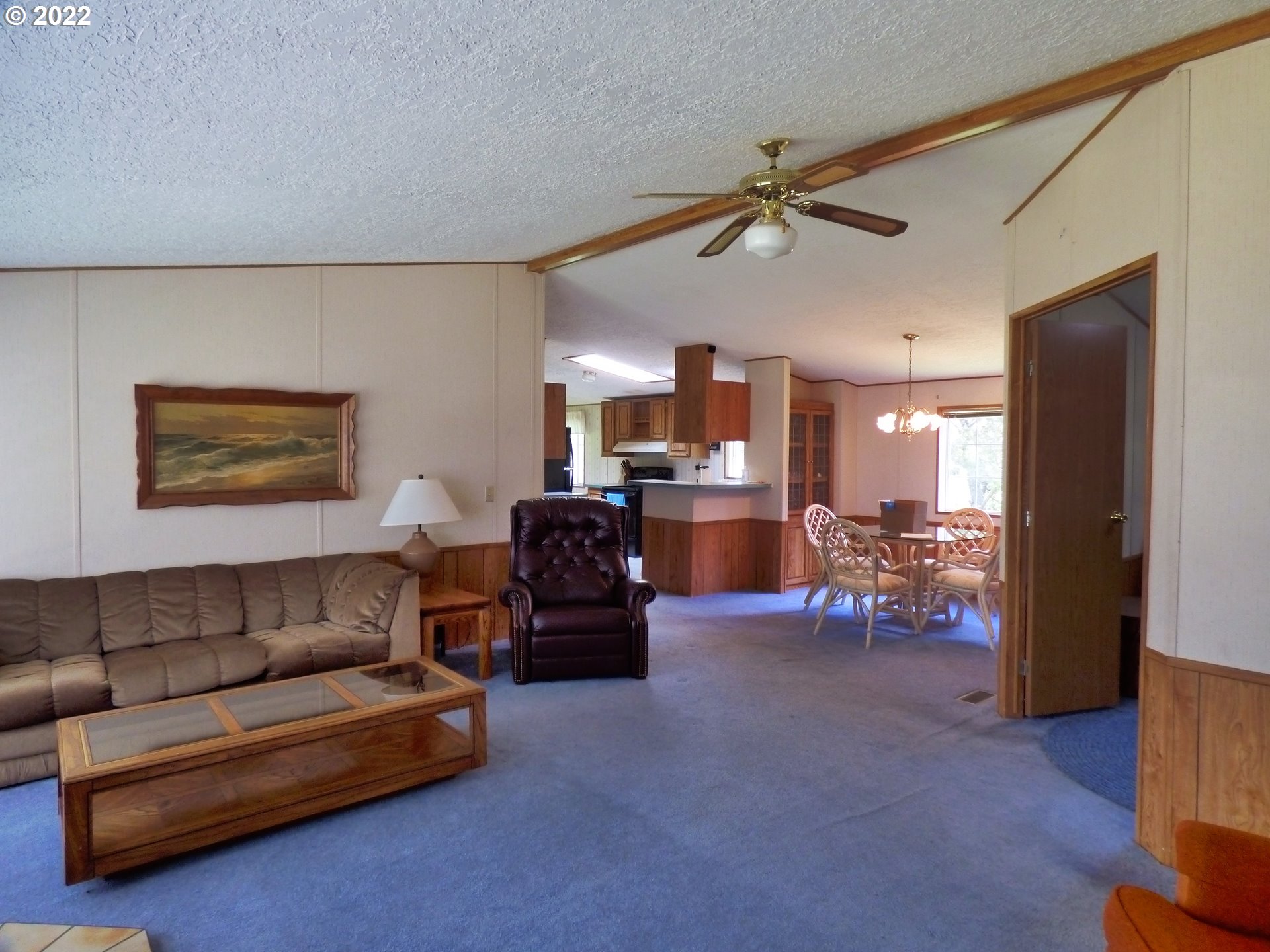 59254 Seven Devils Road Bandon, OR 97411 - Photo 14 of 31 a living room with furniture and a flat screen tv