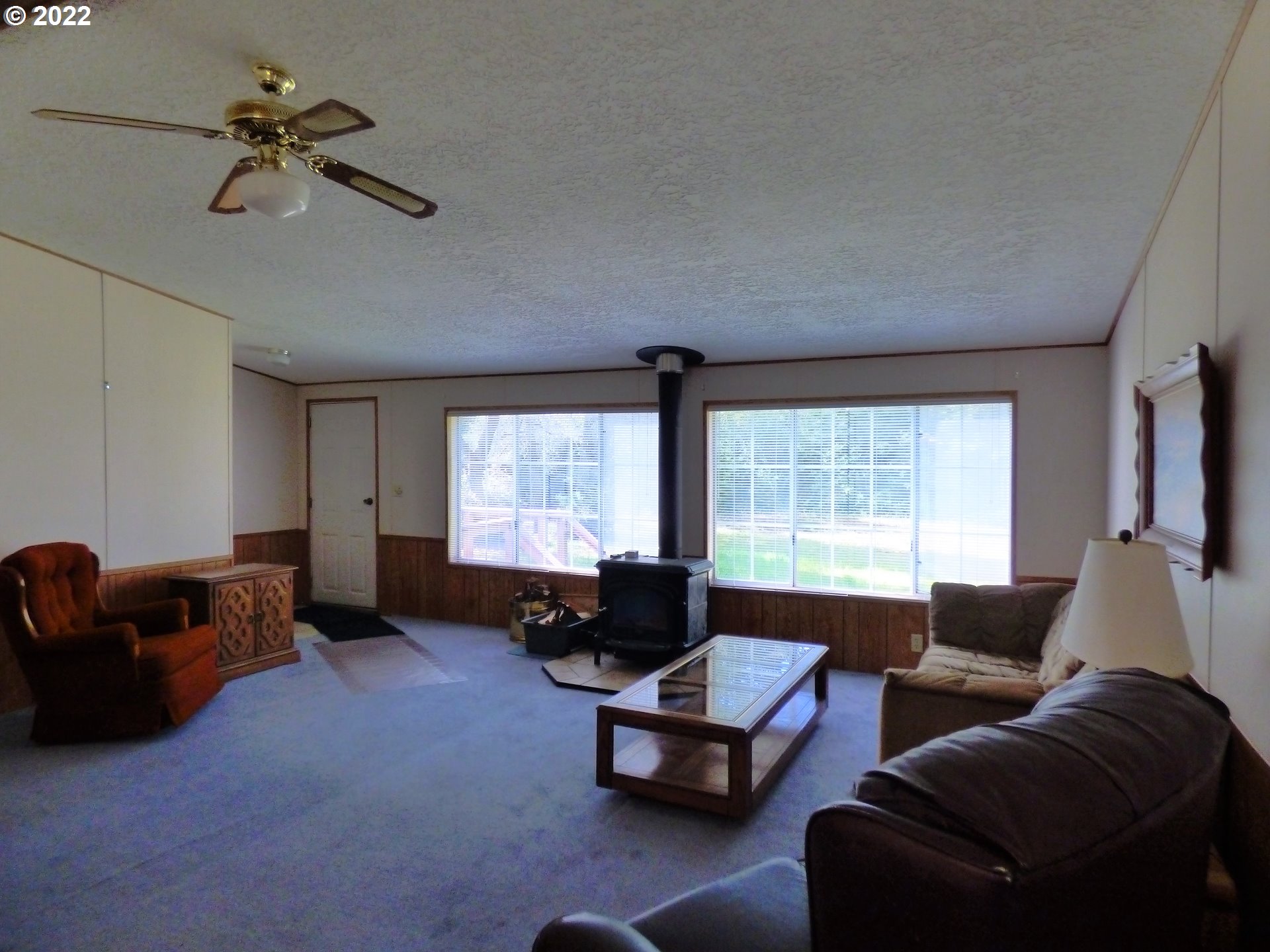 59254 Seven Devils Road Bandon, OR 97411 - Photo 15 of 31 a living room with furniture and a window