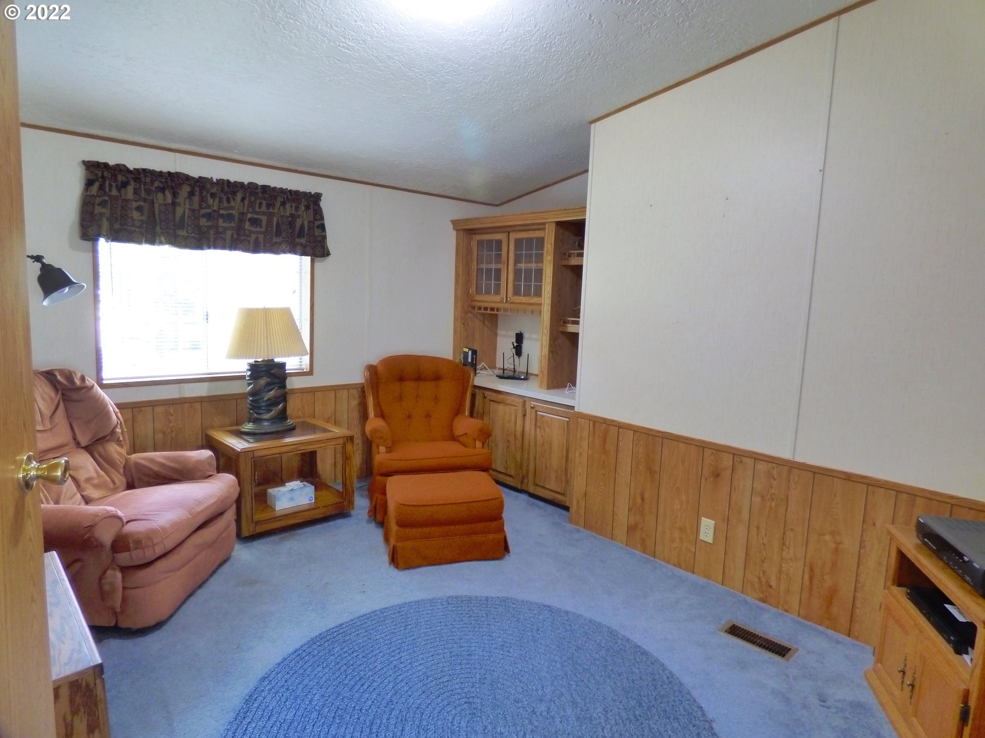 59254 Seven Devils Road Bandon, OR 97411 - Photo 24 of 31 a living room with furniture and a window