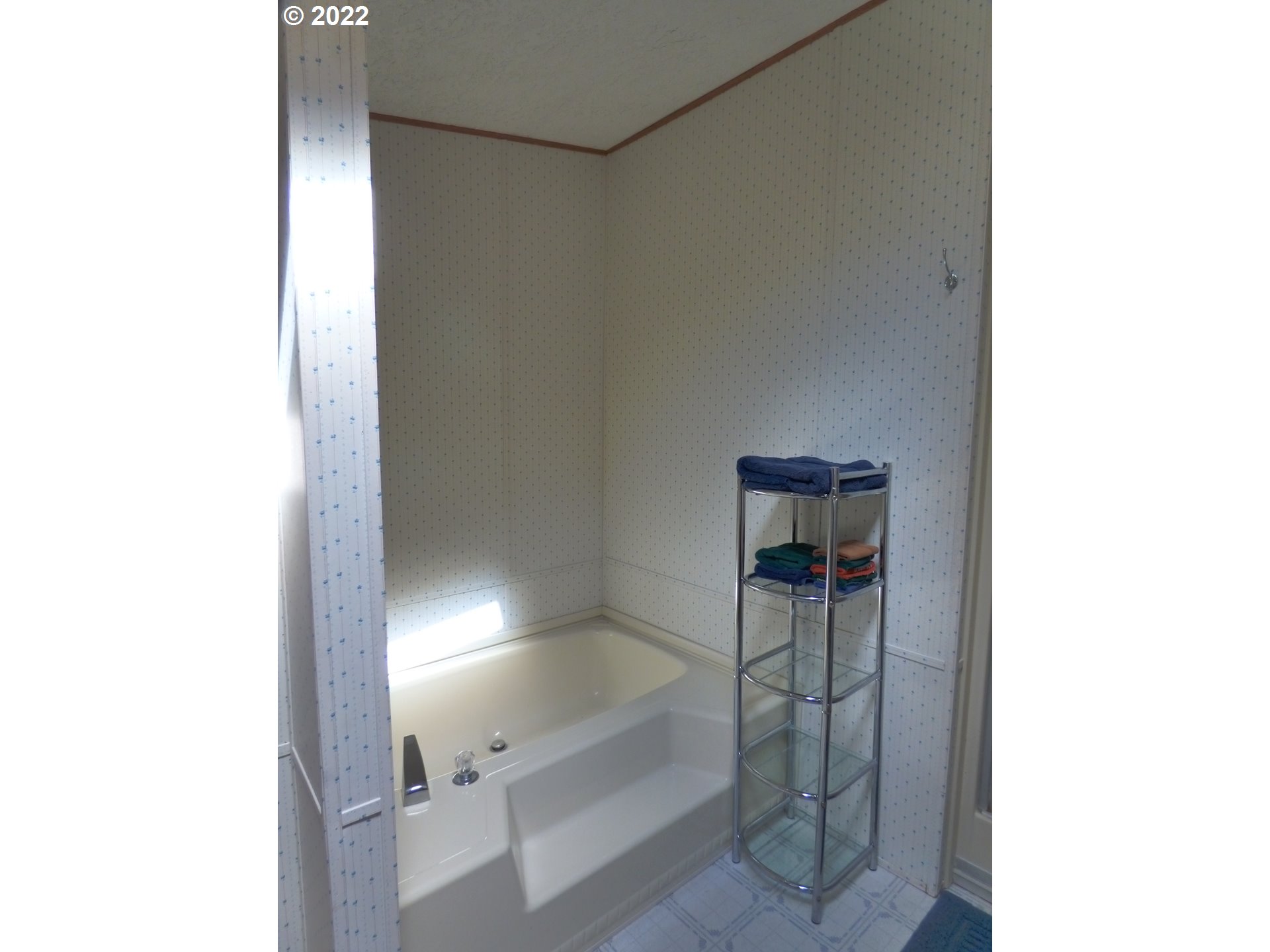 59254 Seven Devils Road Bandon, OR 97411 - Photo 27 of 31 a bathroom with a bathtub and shower