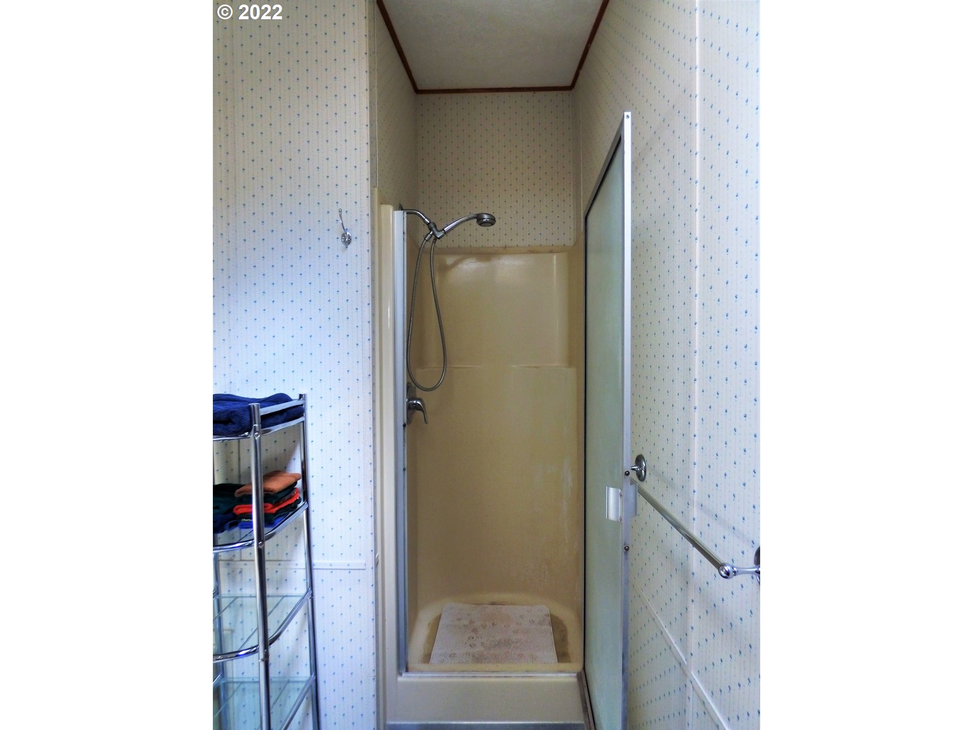 59254 Seven Devils Road Bandon, OR 97411 - Photo 28 of 31 a bathroom with a glass shower door
