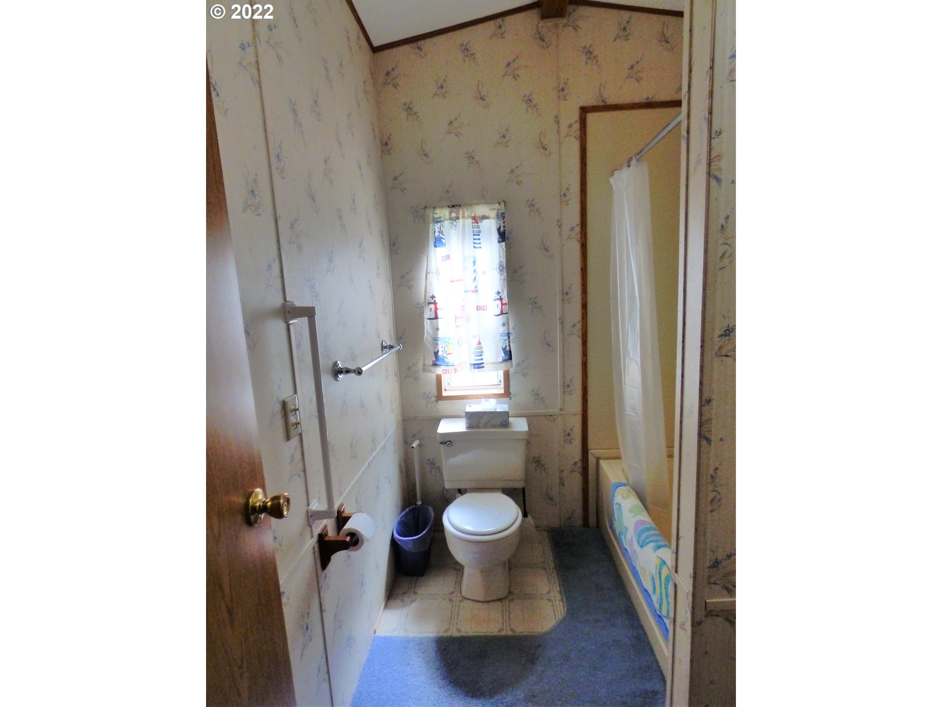 59254 Seven Devils Road Bandon, OR 97411 - Photo 31 of 31 a bathroom with a granite countertop toilet and a shower