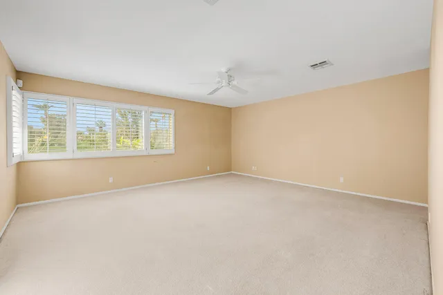 a bedroom with bed and window
