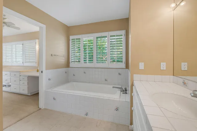 a bathroom with a double vanity sink mirror and double