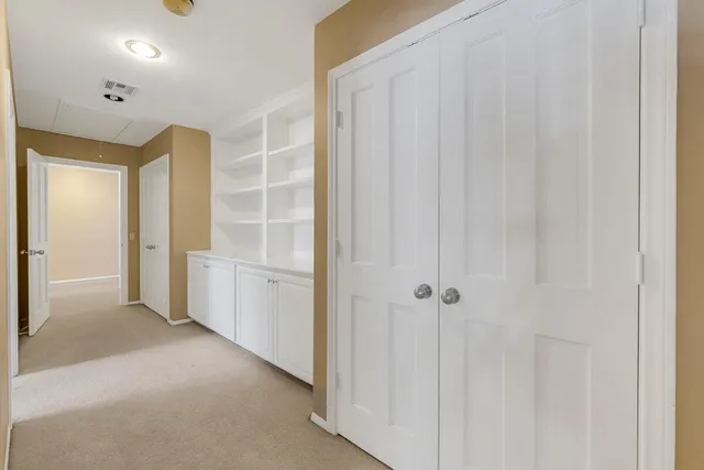 a spacious bedroom with a bed and a couch