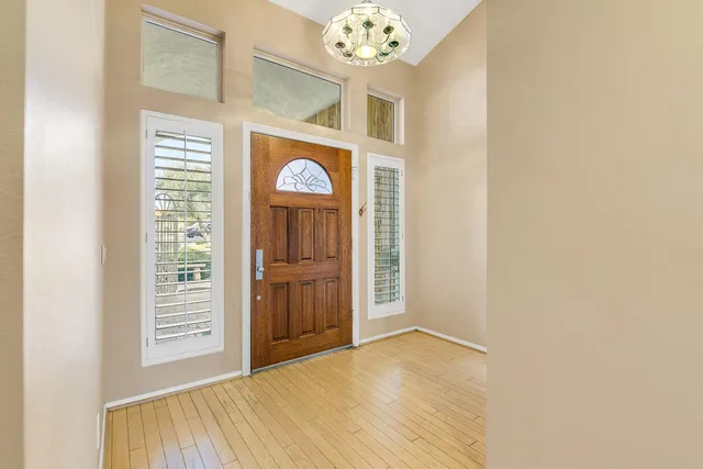 a view of an entryway with a wooden floor