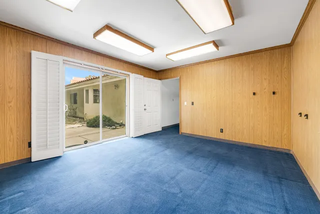 a view of backyard with swimming pool and outdoor seating