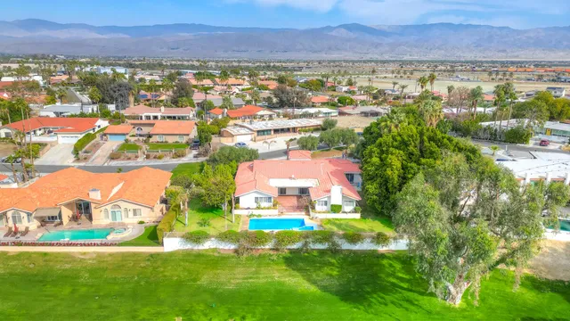 a view of a house with a yard porch and sitting area
