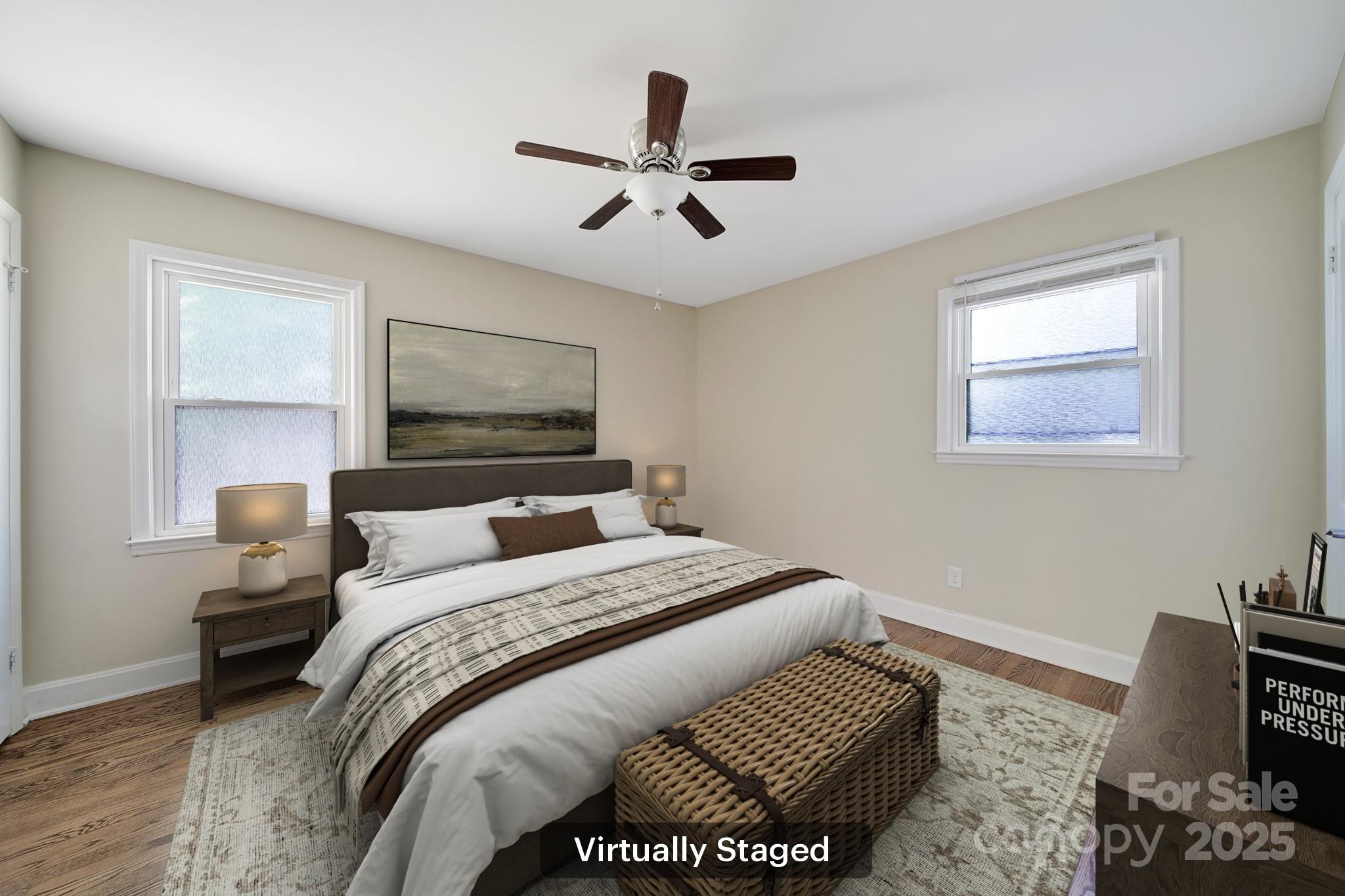 7424 Watercrest Road Charlotte, NC 28210 - Photo 18 of 32 a bedroom with a bed and wooden floor