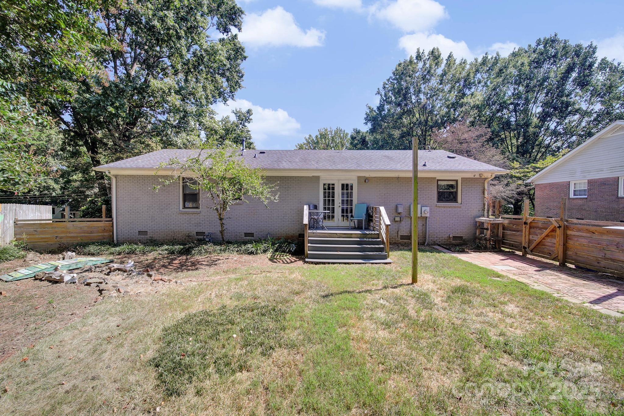 7424 Watercrest Road Charlotte, NC 28210 - Photo 23 of 32 a view of a house with backyard and sitting area
