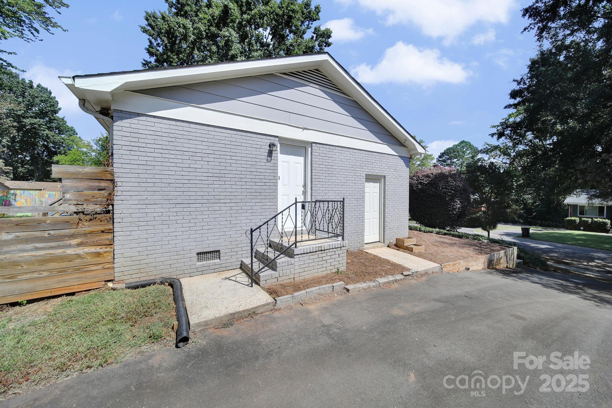 7424 Watercrest Road Charlotte, NC 28210 - Photo 27 of 32 a view of a house with a patio