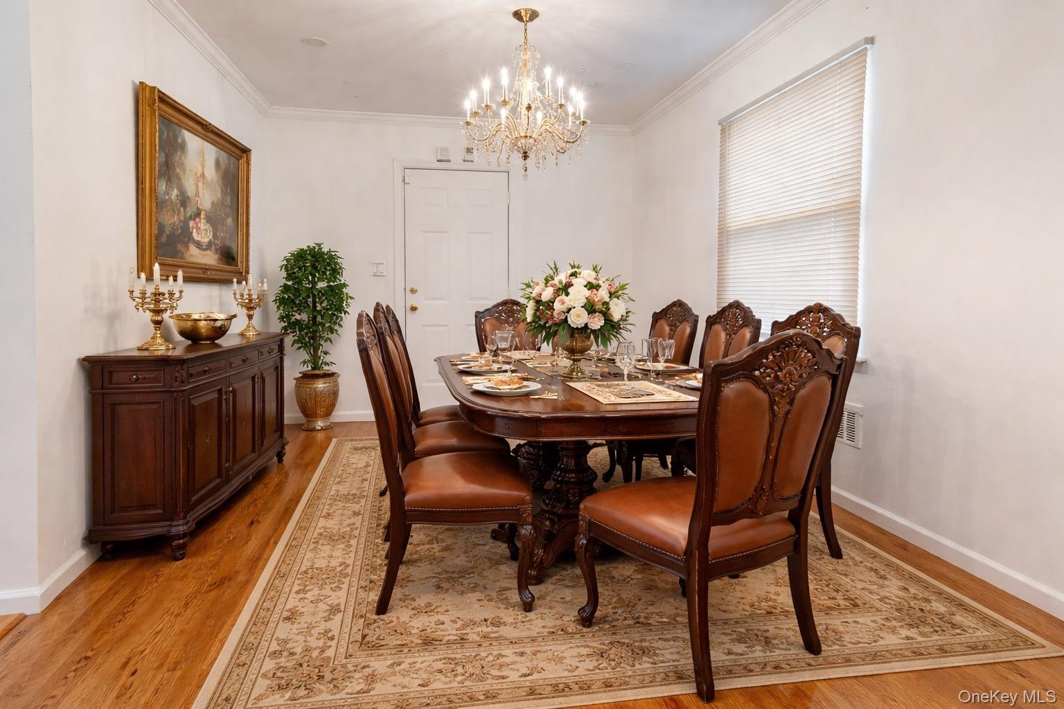 219-42 141st Road Queens, NY 11413 - Photo 6 of 23 a view of a dining room with furniture and chandelier