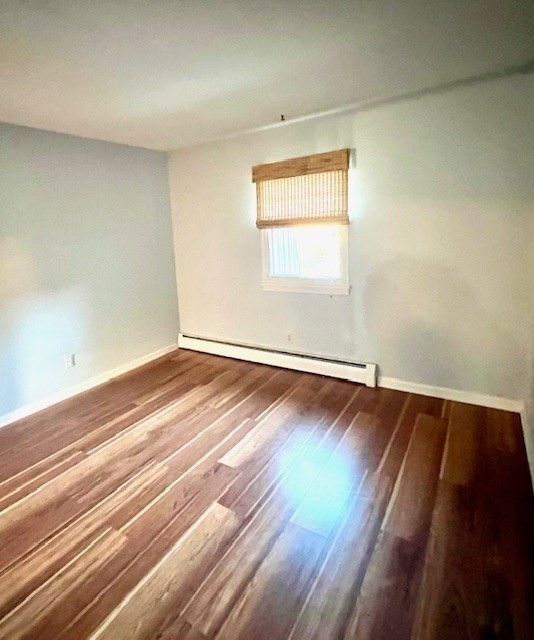 549 Russell Road, Unit 14D Westfield, MA 01085 - Photo 13 of 15 an empty room with wooden floor and windows