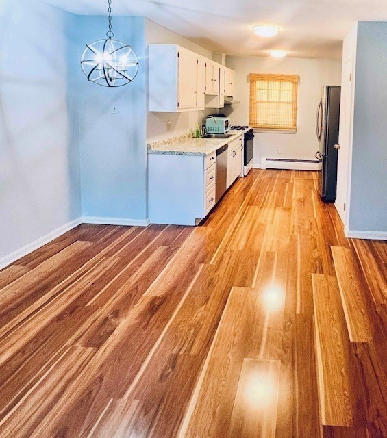 549 Russell Road, Unit 14D Westfield, MA 01085 - Photo 6 of 15 a spacious bathroom with a sink and a mirror
