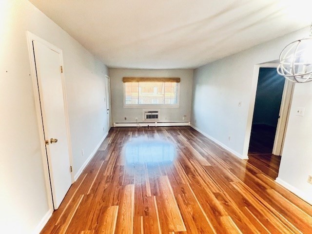 549 Russell Road, Unit 14D Westfield, MA 01085 - Photo 7 of 15 a view of empty room with wooden floor