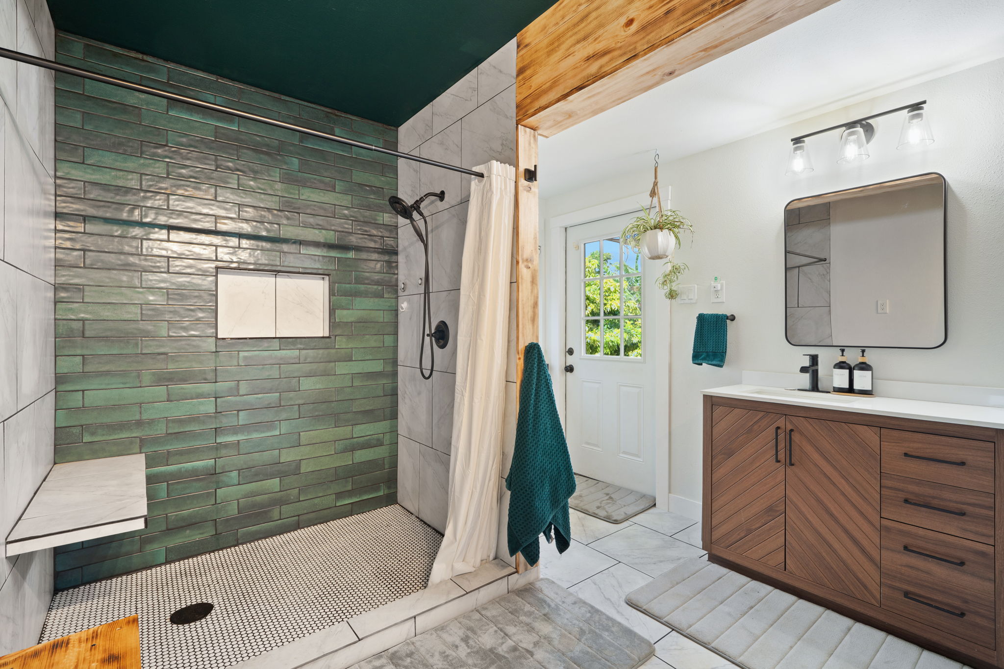 6100 Kawaihau Road Kapaa, HI 96746 - Photo 22 of 22 a bathroom with a sink a toilet a mirror and shower