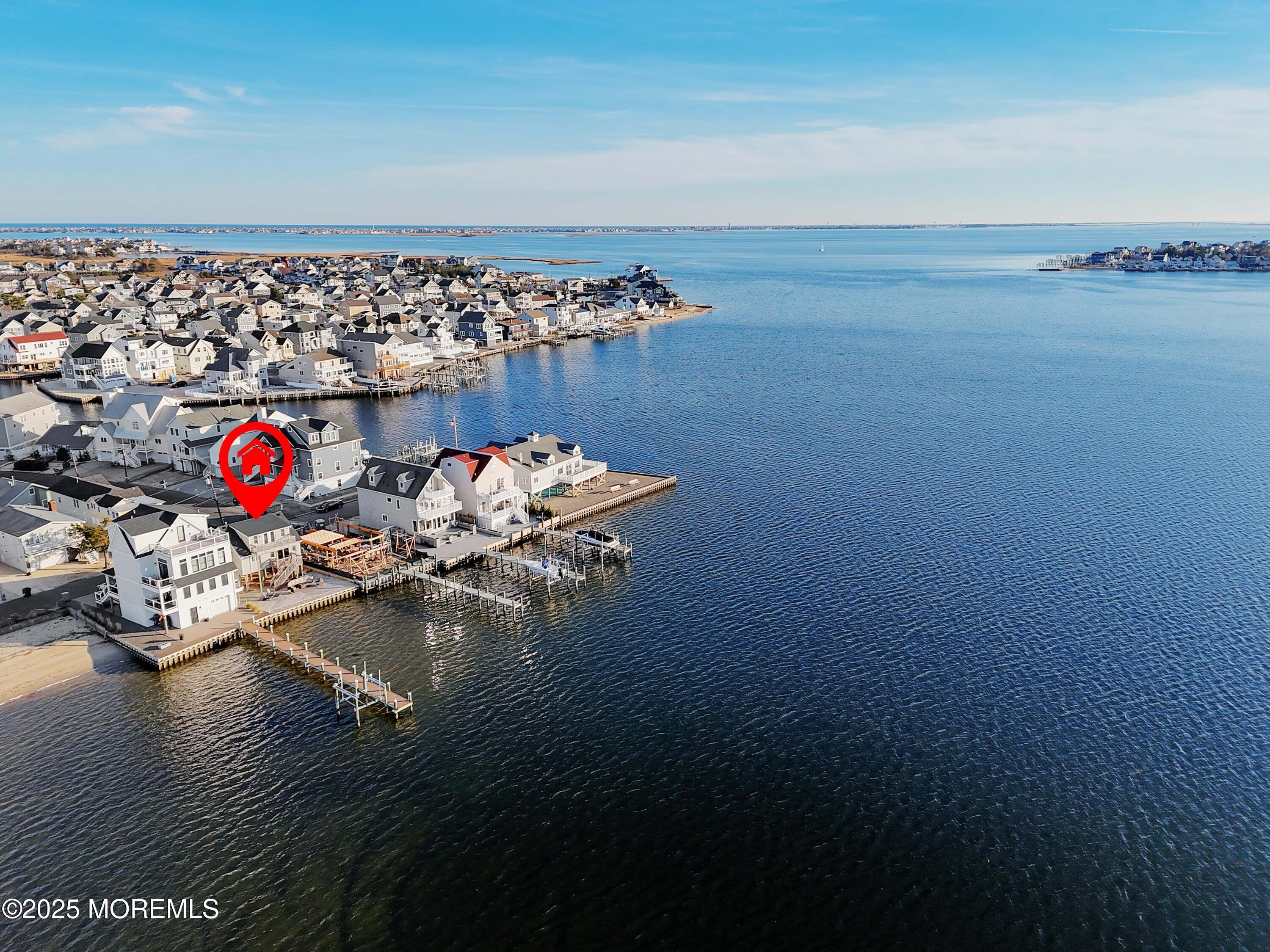 a view of a workspace with wooden floor