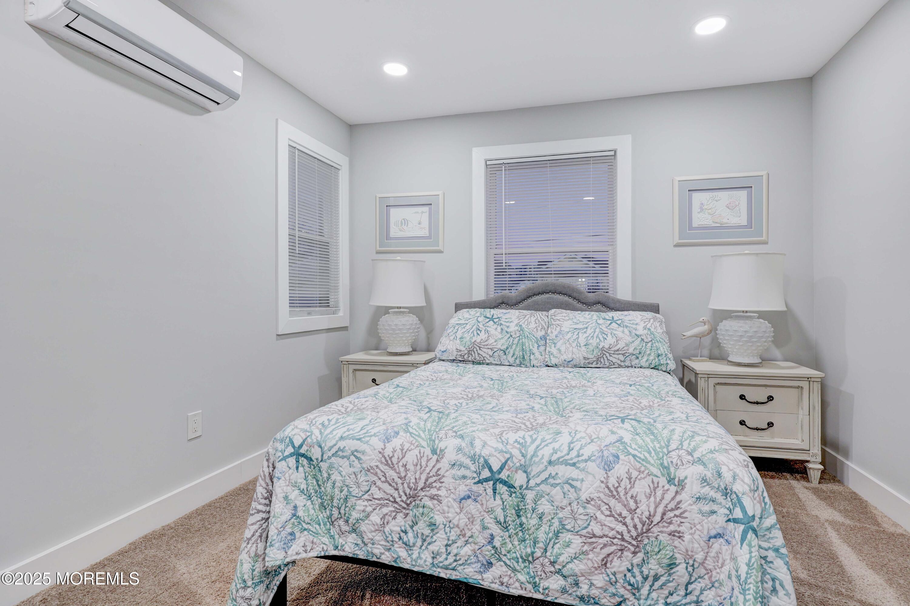 151 Shore Drive Brick, NJ 08723 - Photo 15 of 40 a bedroom with a bed and a window