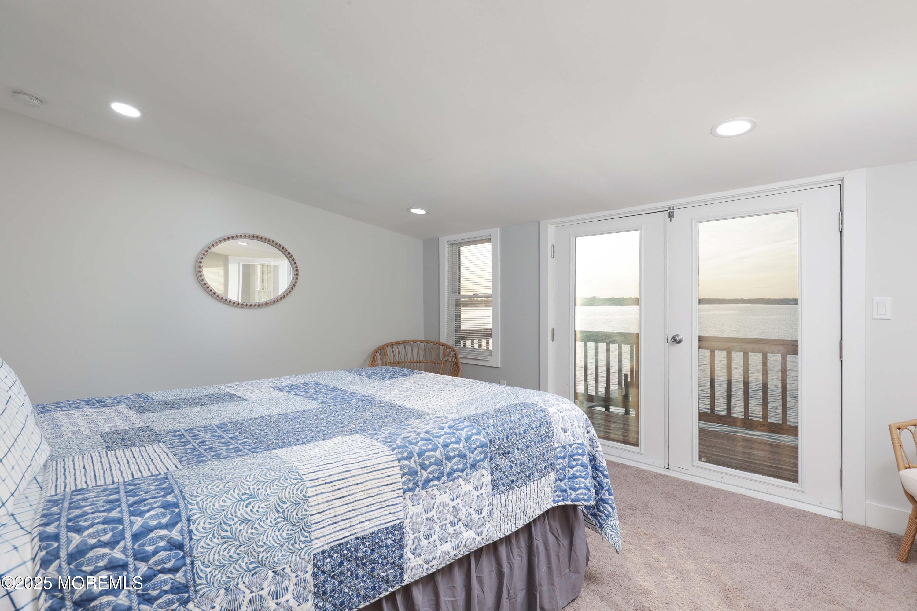151 Shore Drive Brick, NJ 08723 - Photo 19 of 40 a bedroom with a large bed and a window