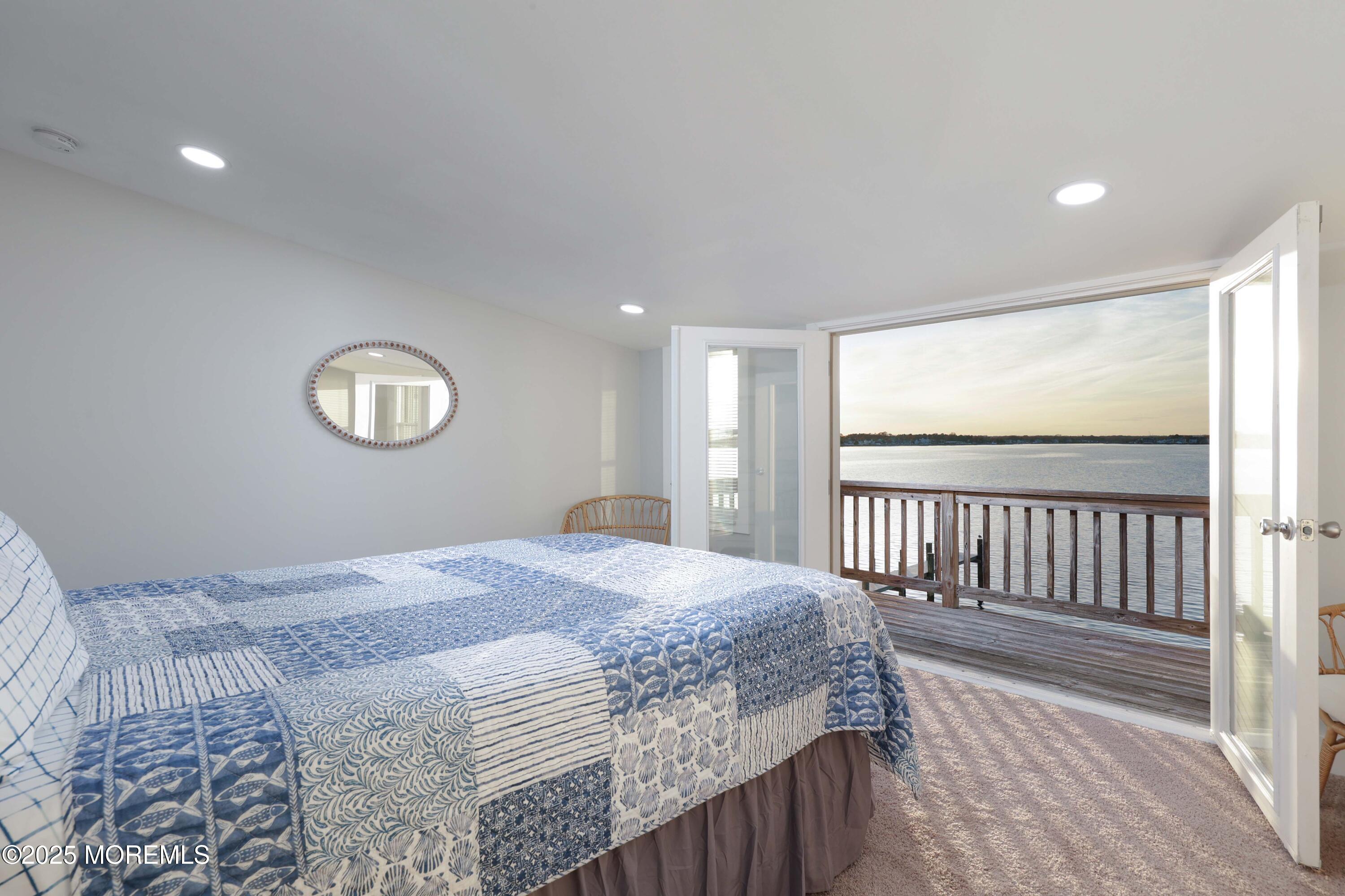 151 Shore Drive Brick, NJ 08723 - Photo 20 of 40 a bedroom with a bed and a window