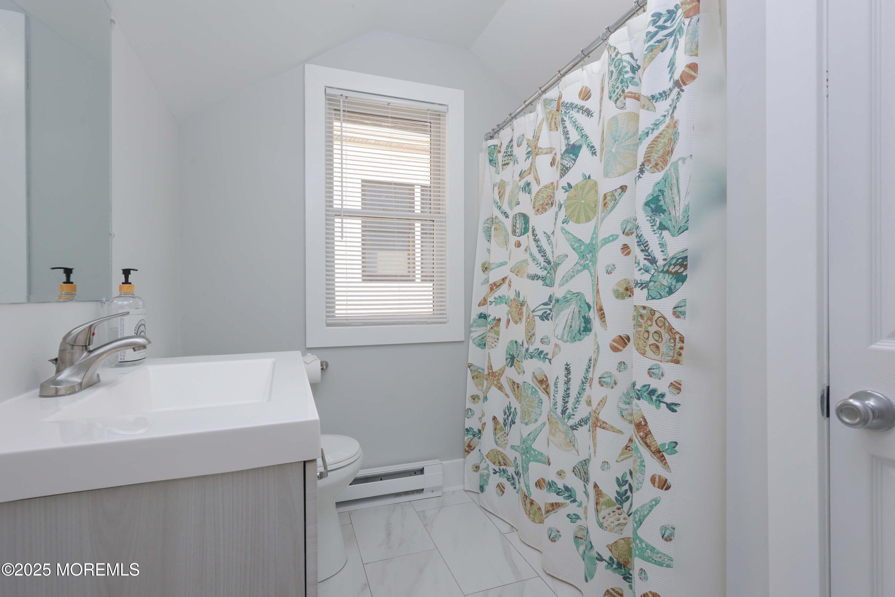 151 Shore Drive Brick, NJ 08723 - Photo 22 of 40 a bathroom with a sink and a mirror