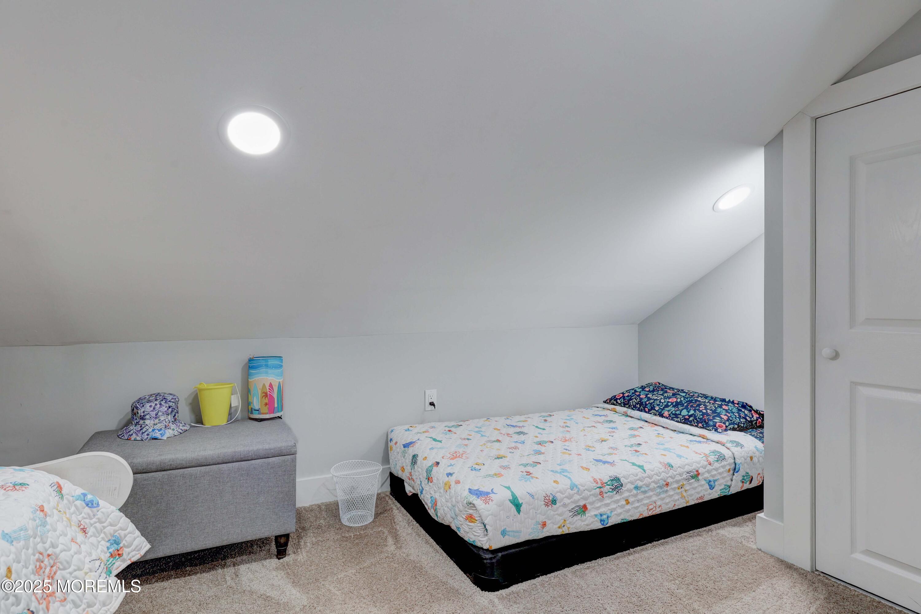 151 Shore Drive Brick, NJ 08723 - Photo 23 of 40 a bedroom with a bed and a window