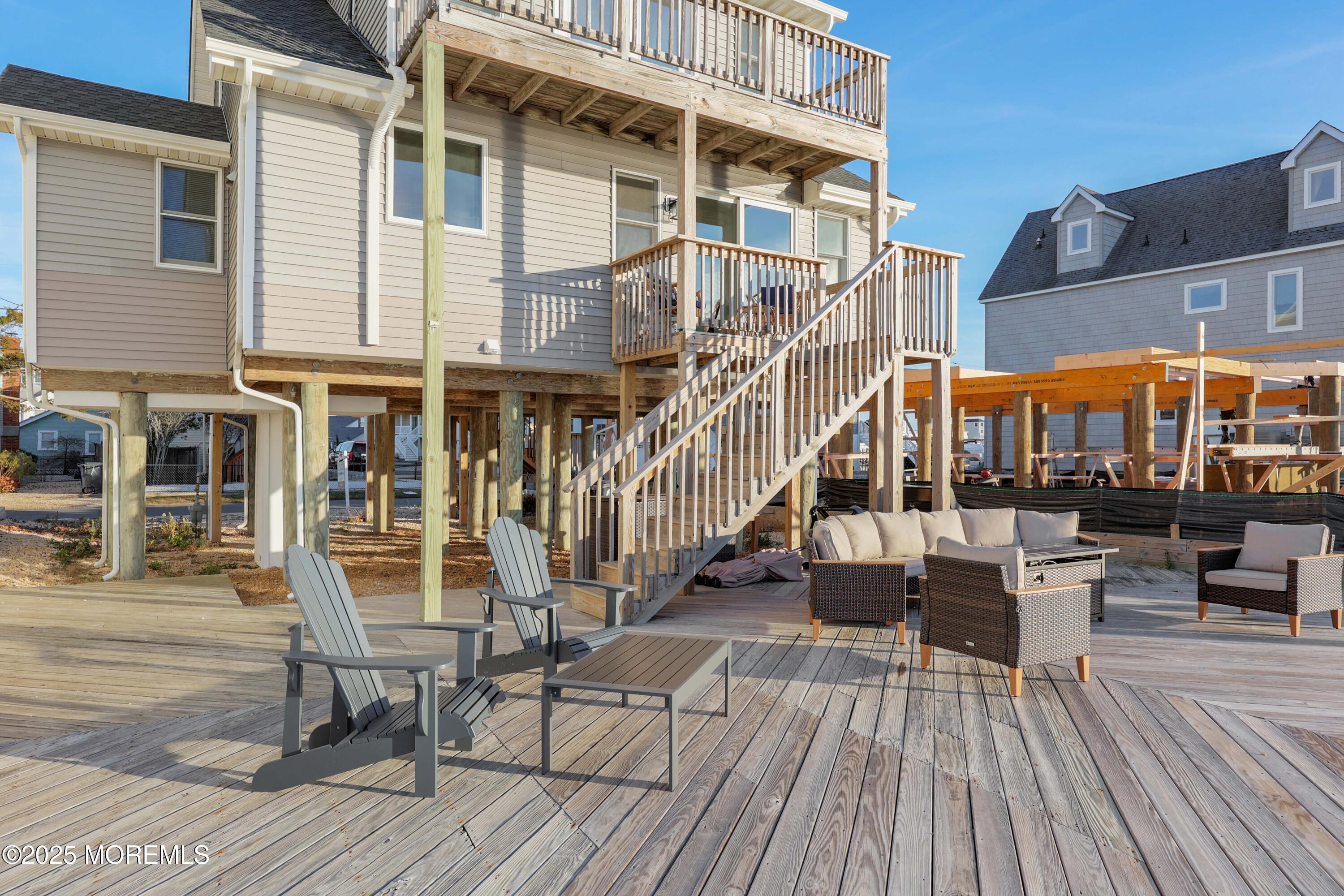 151 Shore Drive Brick, NJ 08723 - Photo 29 of 40 a view of a brick building with a table and chairs
