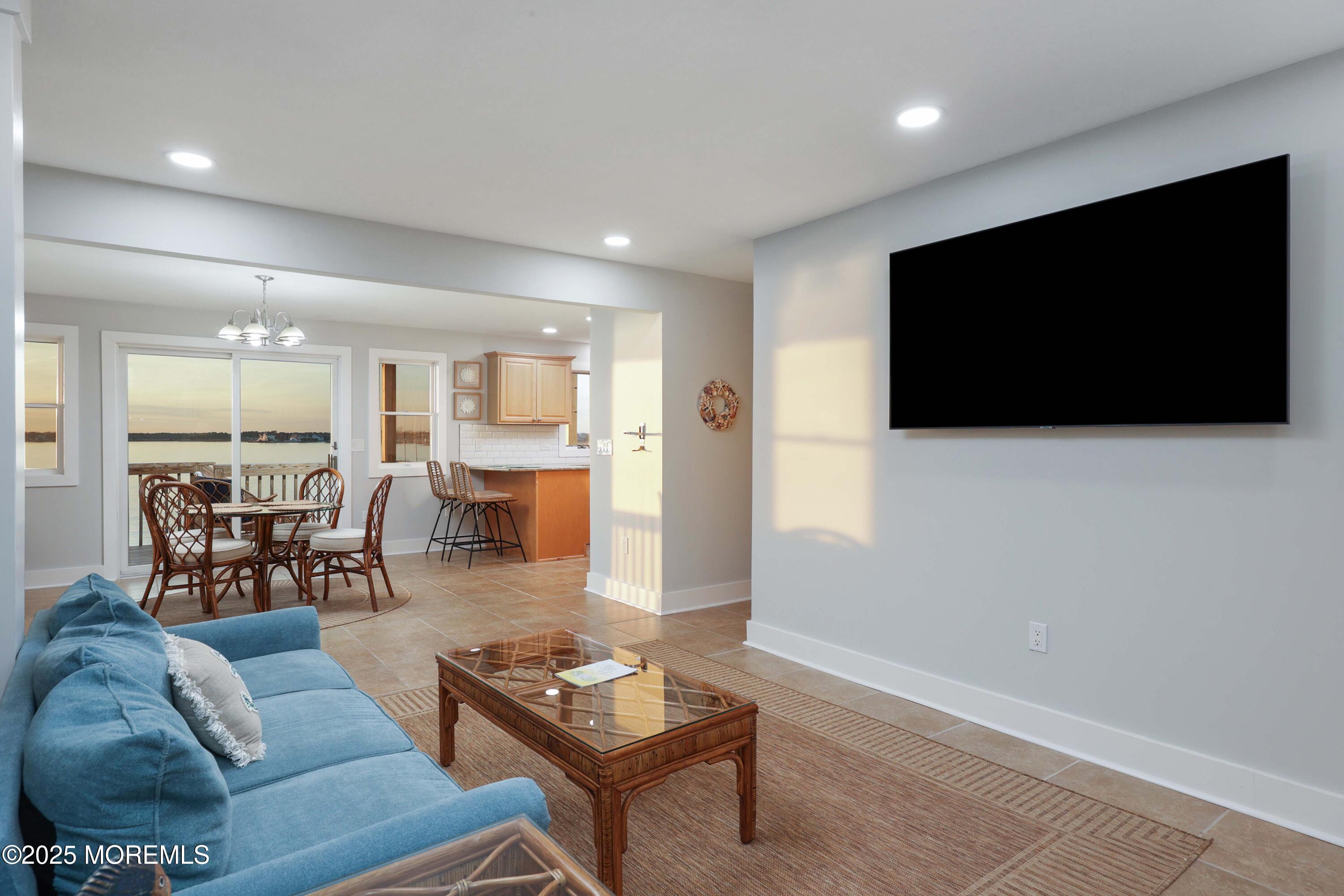 151 Shore Drive Brick, NJ 08723 - Photo 7 of 40 a living room with furniture and a flat screen tv