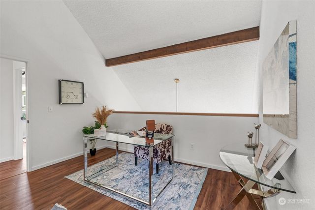 a workspace with furniture and wooden floor