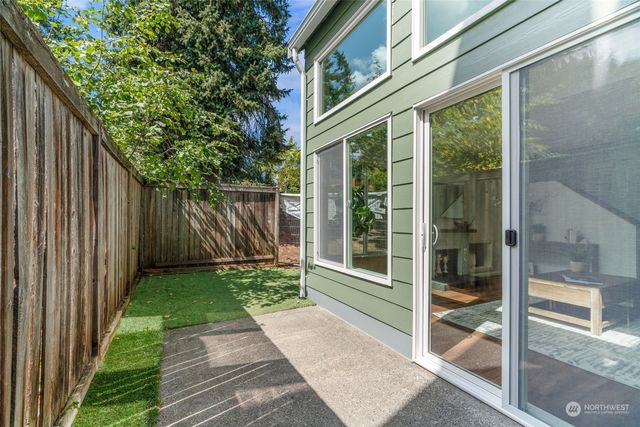 a front view of a house with outdoor seating