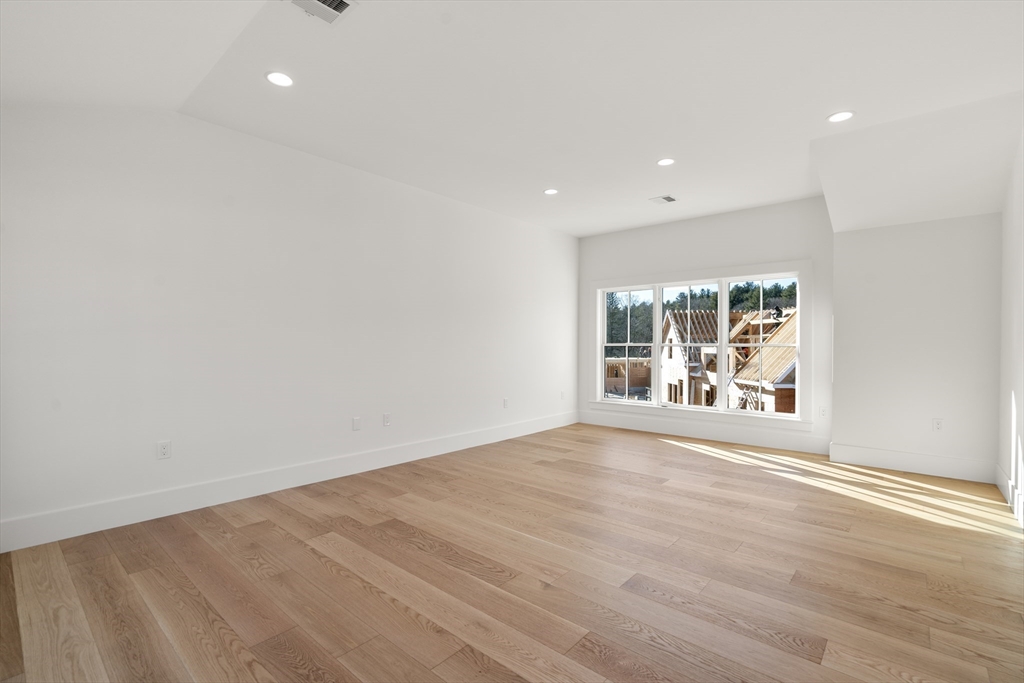 1060 Grove Street, Unit LOT 43 Framingham, MA 01701 - Photo 10 of 15 wooden floor in an empty room with a window