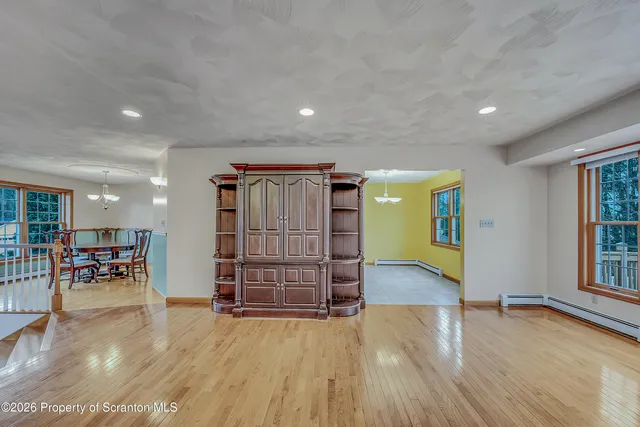 a view of a livingroom with furniture and wooden floor
