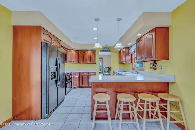 a group of chairs sitting in kitchen and dining room