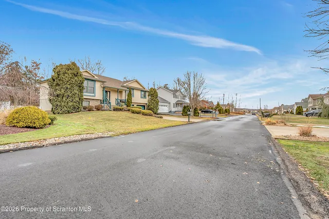 a view of a city street with a building in the background