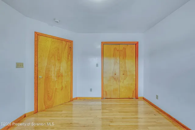 a view of an empty room with windows