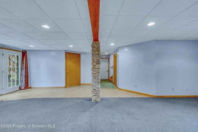 a view of an empty room with a fireplace